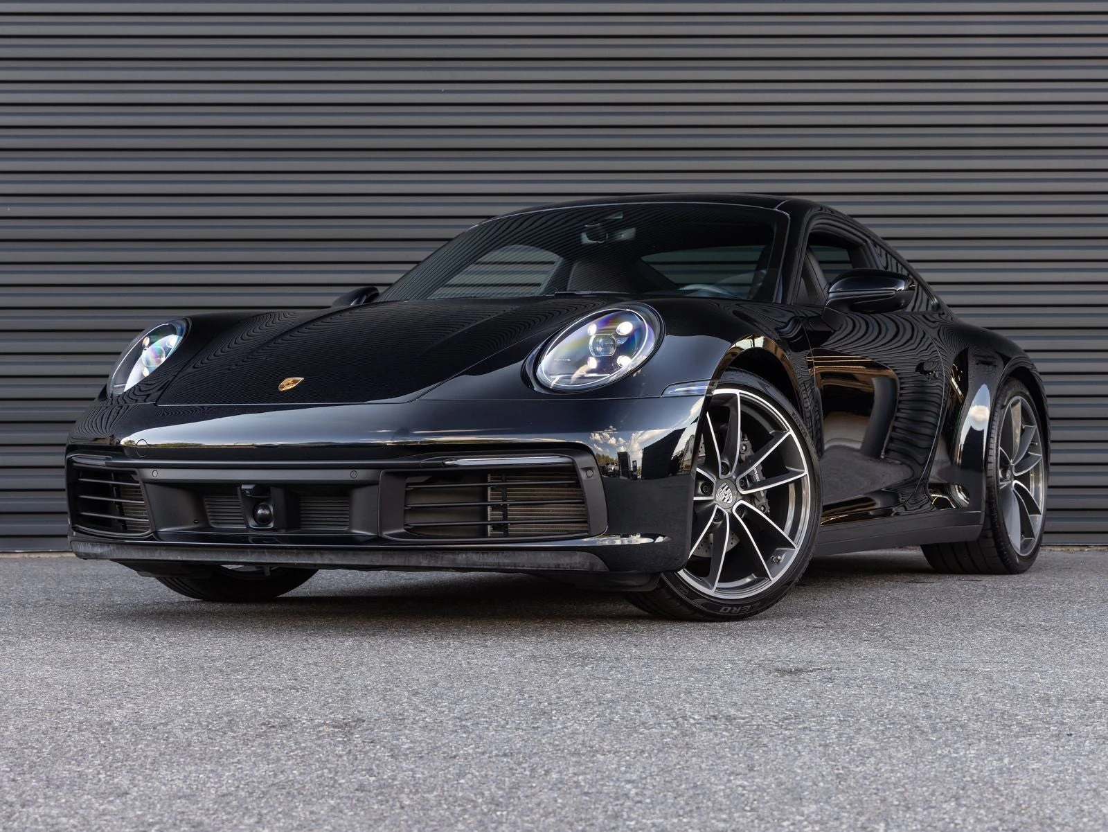 Porsche 911 Carrera (992.1) · Jet Black Metallic · Indigo Auto Group