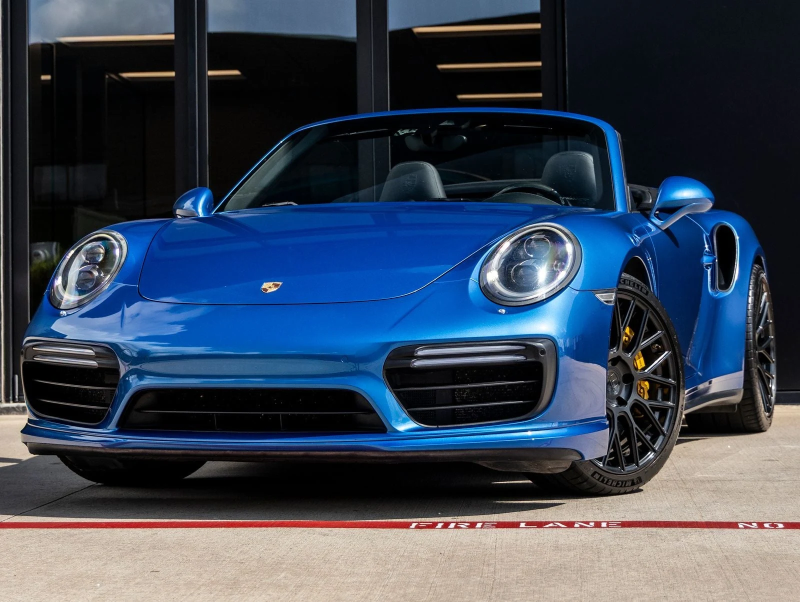 Porsche 911 Turbo S Cabriolet (991.2) · Sapphire Blue Metallic · Indigo Auto Group
