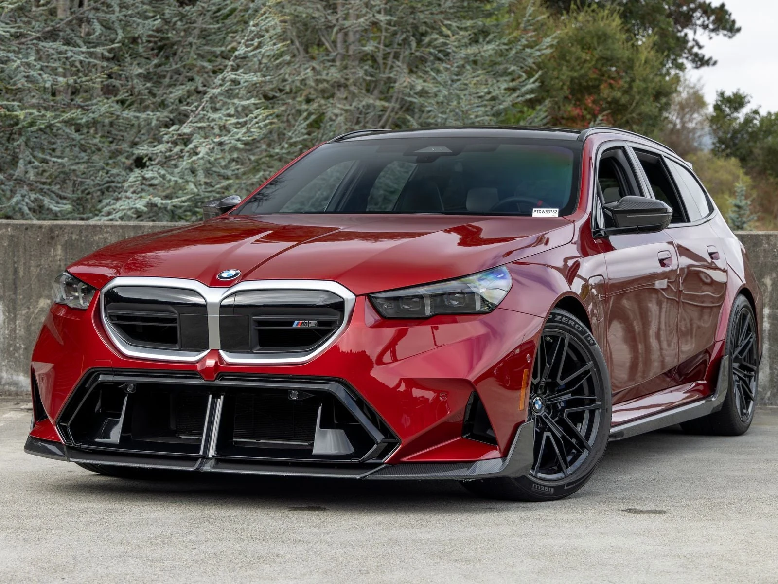 BMW M5 Touring (G99) · Vegas Red Metallic · Indigo Auto Group