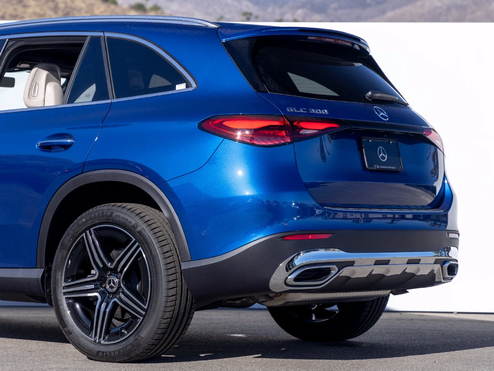 2027 Mercedes-Benz GLC GLC 300, rear three-quarter view, Starling Blue Metallic