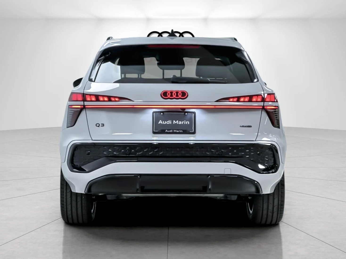 2026 Audi Q3 S line quattro, rear three-quarter view, Glacier White Metallic