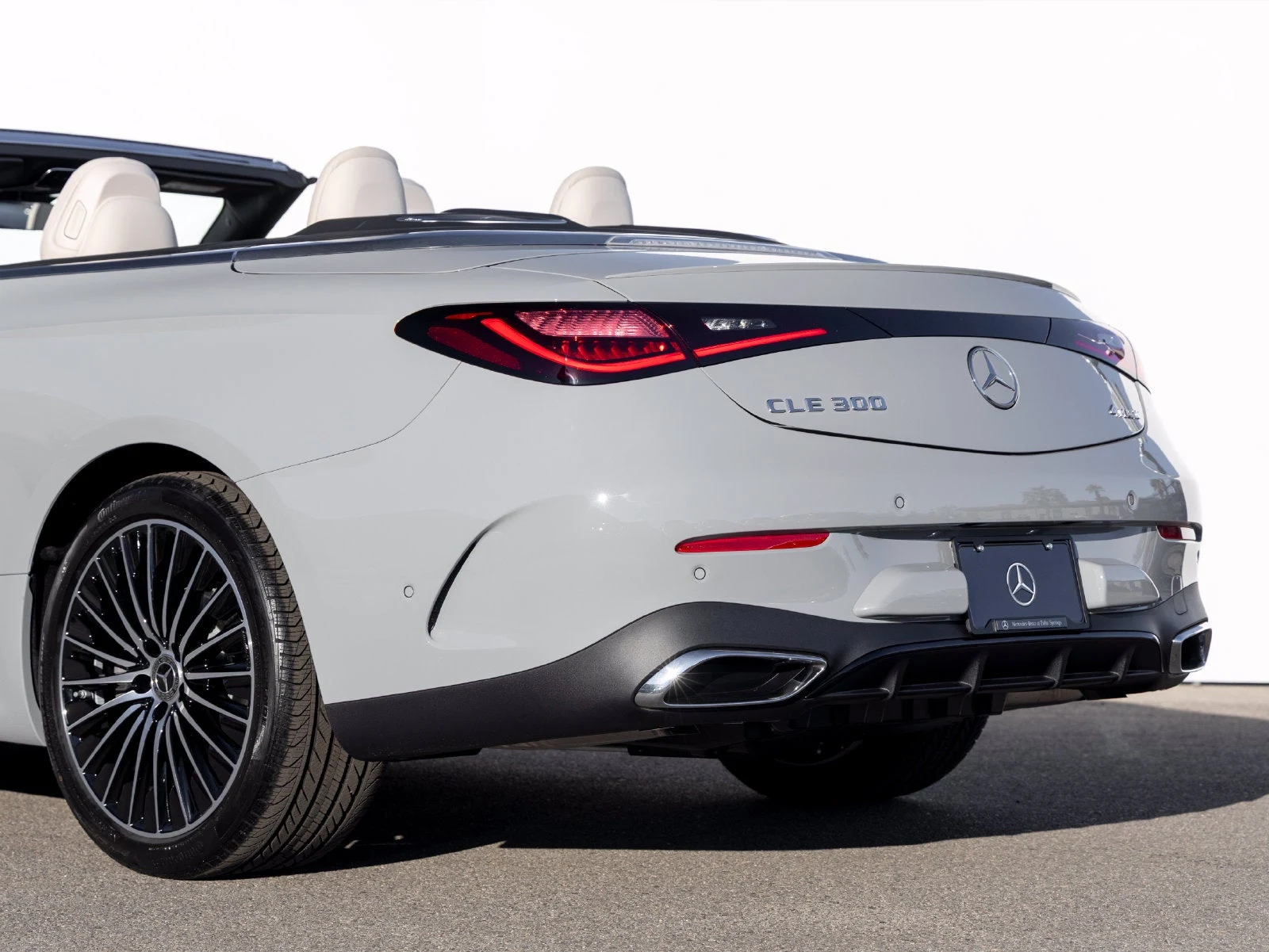 2027 Mercedes-Benz CLE 300 4MATIC Cabriolet, rear three-quarter view, Manufaktur Alpine Grey Metallic