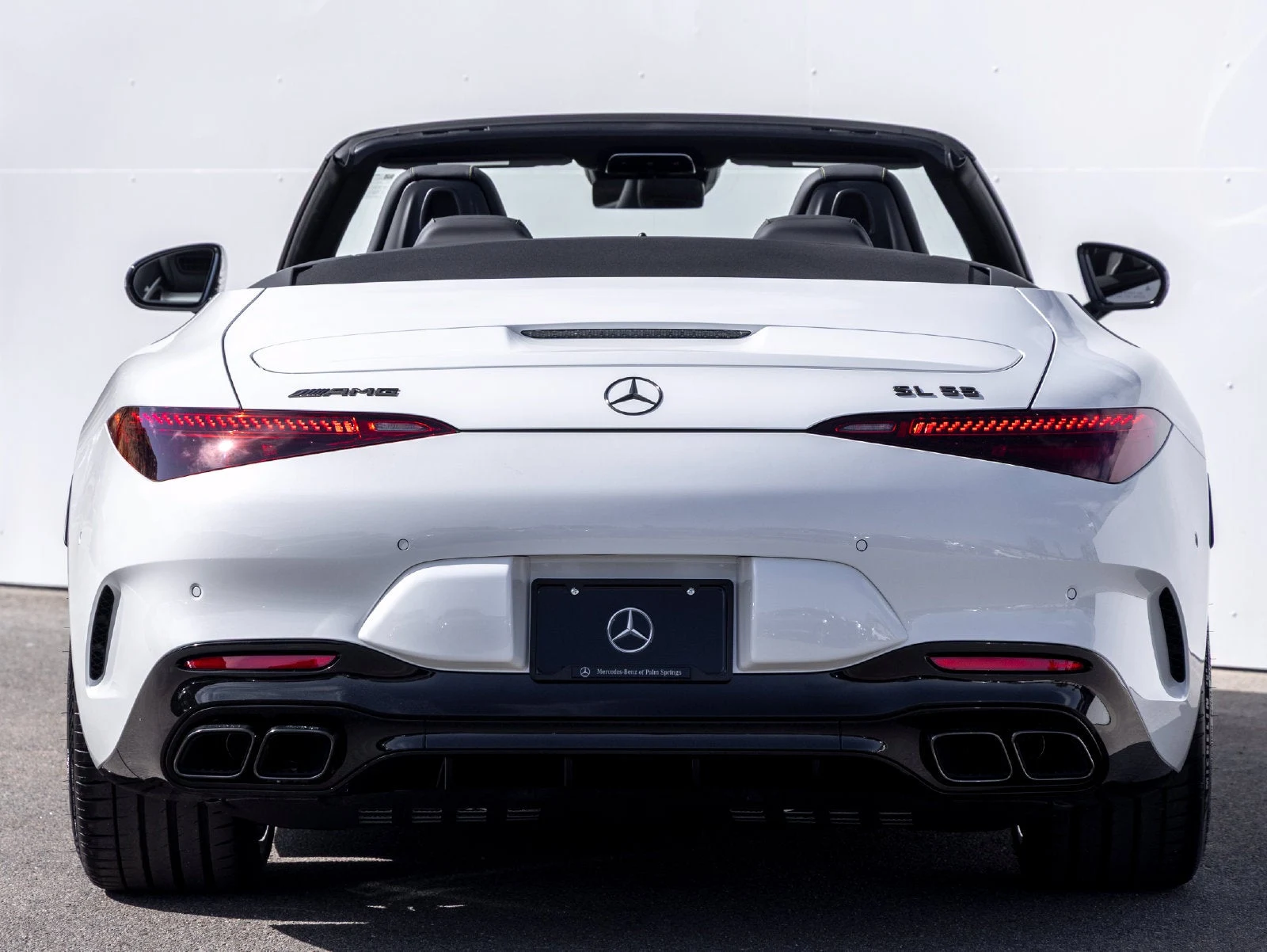 2027 Mercedes-AMG SL 55 4MATIC+, rear three-quarter view, Manufaktur Moonlight White Metallic