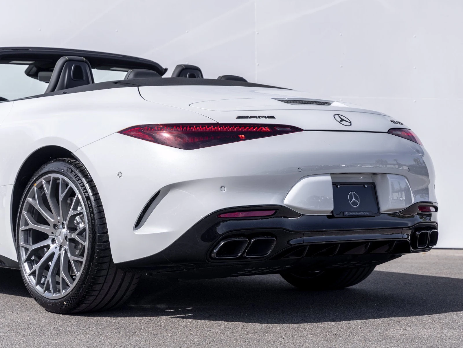 2027 Mercedes-AMG SL 55 4MATIC+, rear three-quarter view, Manufaktur Moonlight White Metallic