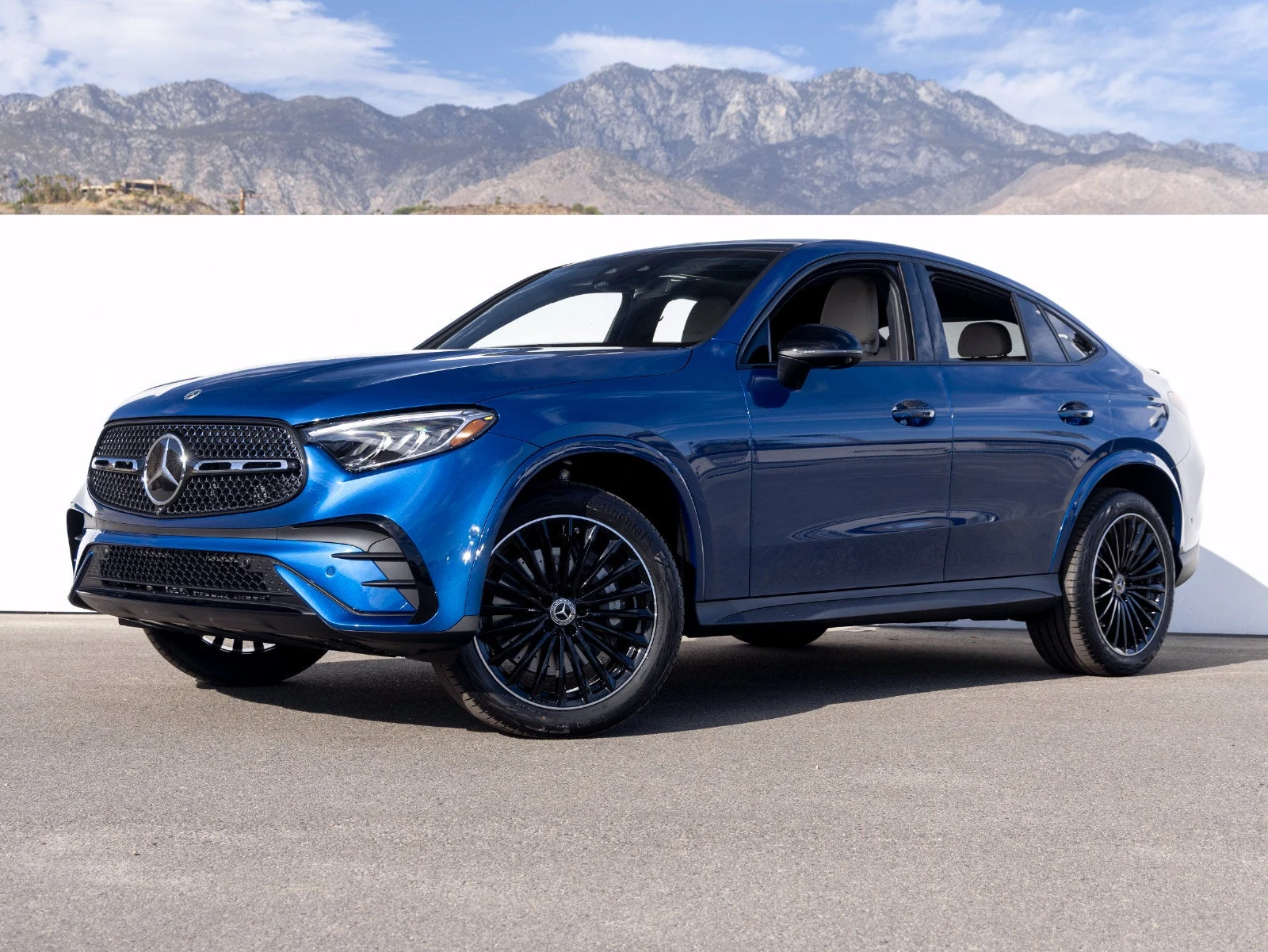 2027 Mercedes-Benz GLC 300 4MATIC Coupé for sale, front three-quarter view, Starling Blue Metallic
