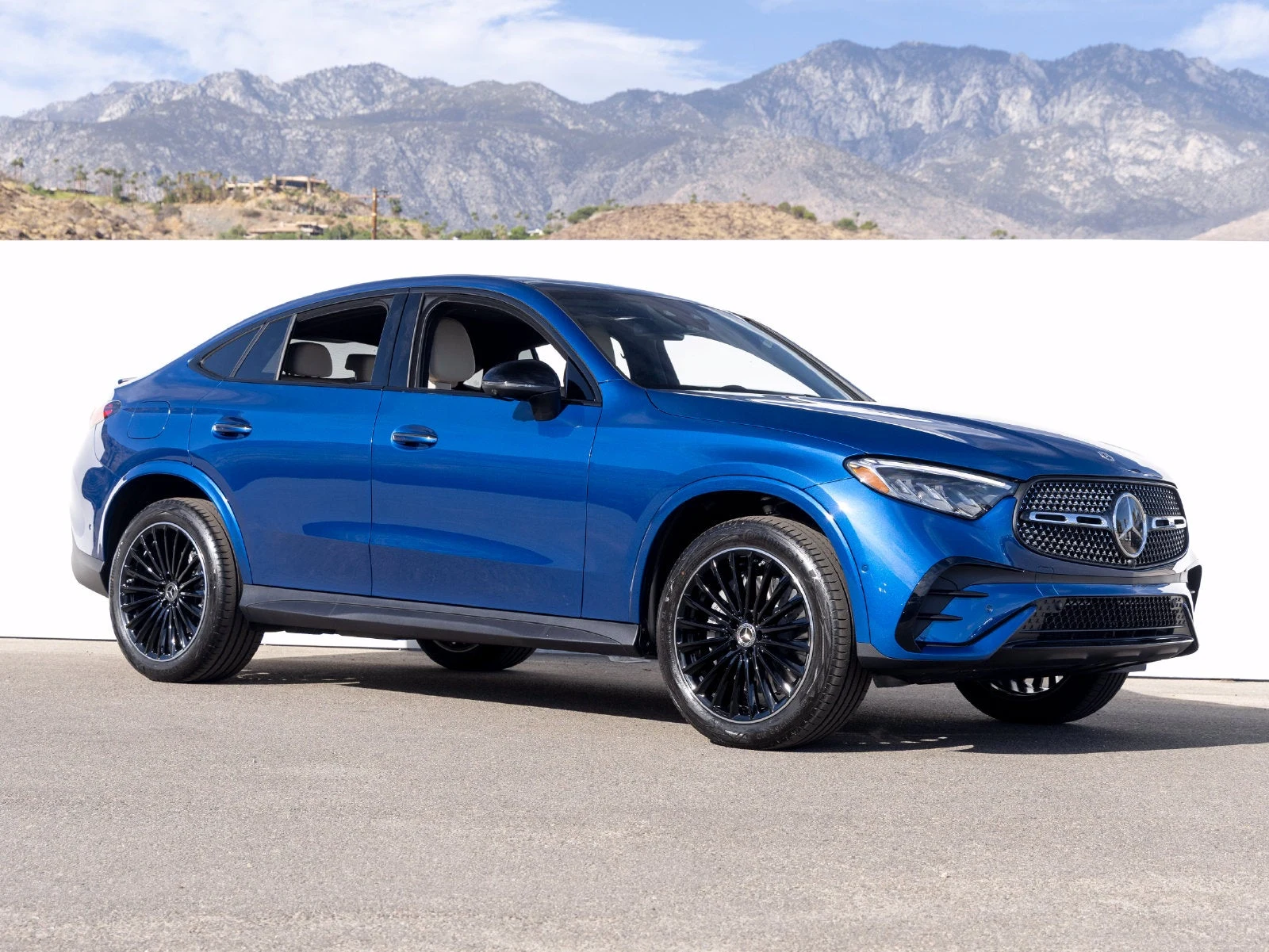 2027 Mercedes-Benz GLC 300 4MATIC Coupé for sale, front three-quarter view, Starling Blue Metallic
