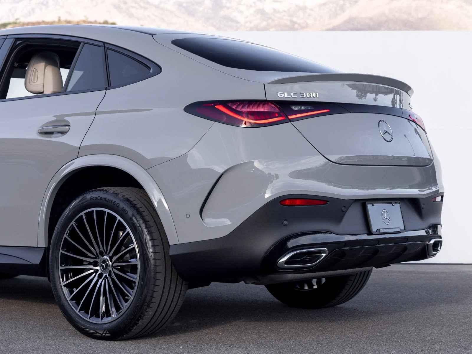 2027 Mercedes-Benz GLC 300 4MATIC Coupé, rear three-quarter view, Manufaktur Alpine Grey