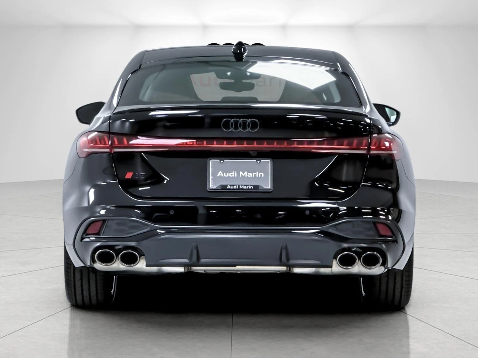 2026 Audi S5 Premium Plus quattro, rear three-quarter view, Mythos Black Metallic