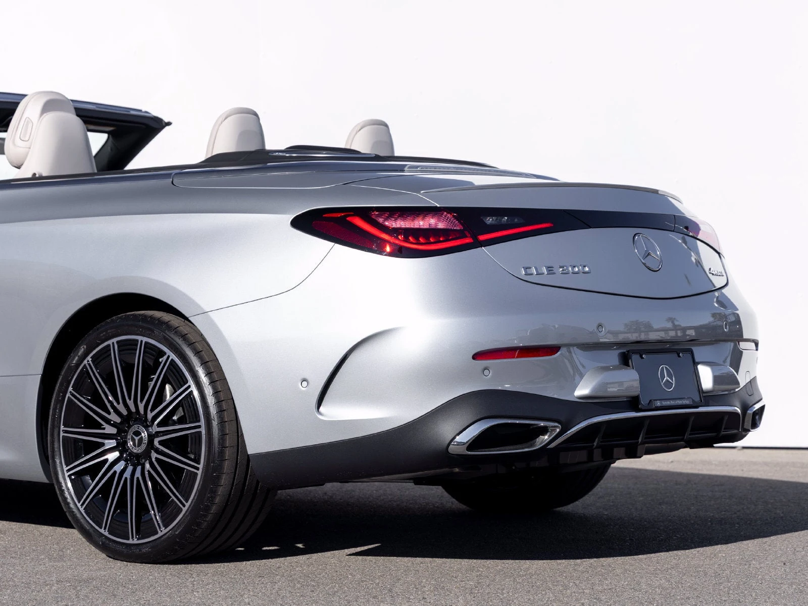2027 Mercedes-Benz CLE 300 4MATIC Cabriolet, rear three-quarter view, Cirrus Silver Metallic
