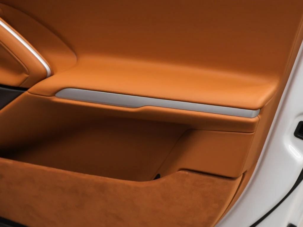 2026 Ferrari Purosangue interior, door panel, Cuoio leather with Iroko accents