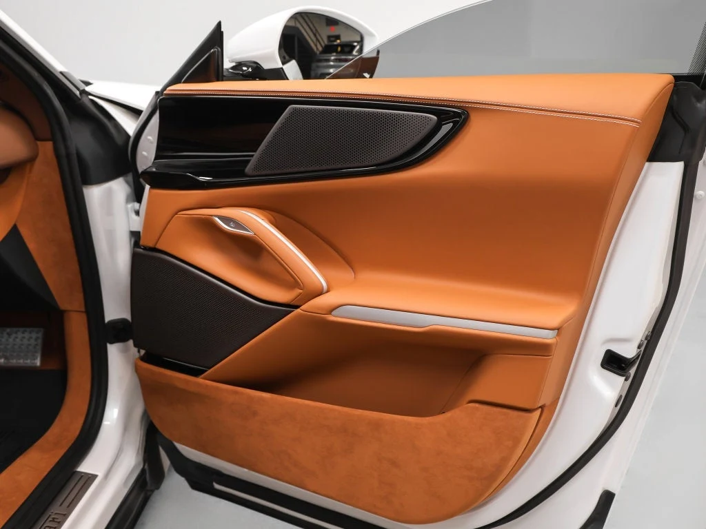 2026 Ferrari Purosangue interior, door panel, Cuoio leather with Iroko accents