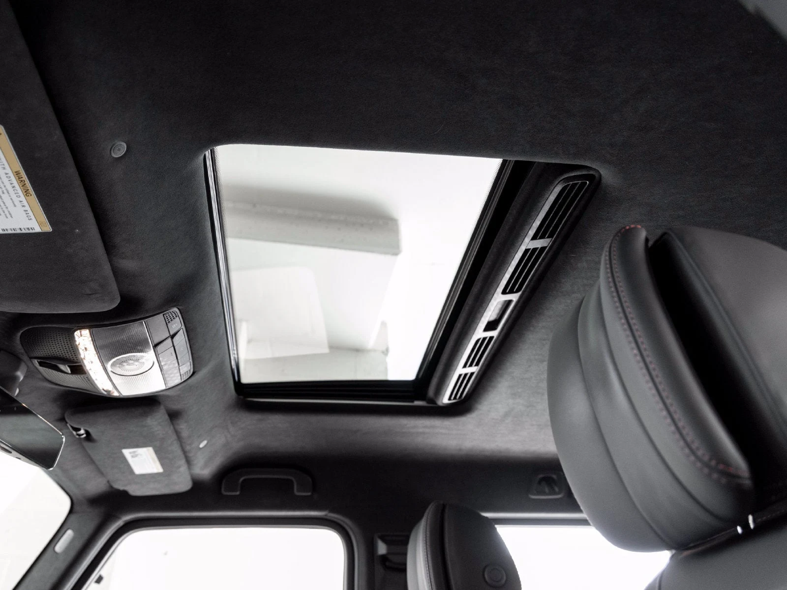 2022 Mercedes-AMG G 63 interior, door panel, Bengal Red / Black leather