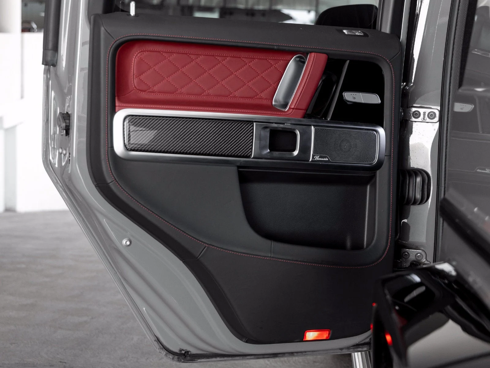 2022 Mercedes-AMG G 63 interior, door panel, Bengal Red / Black leather