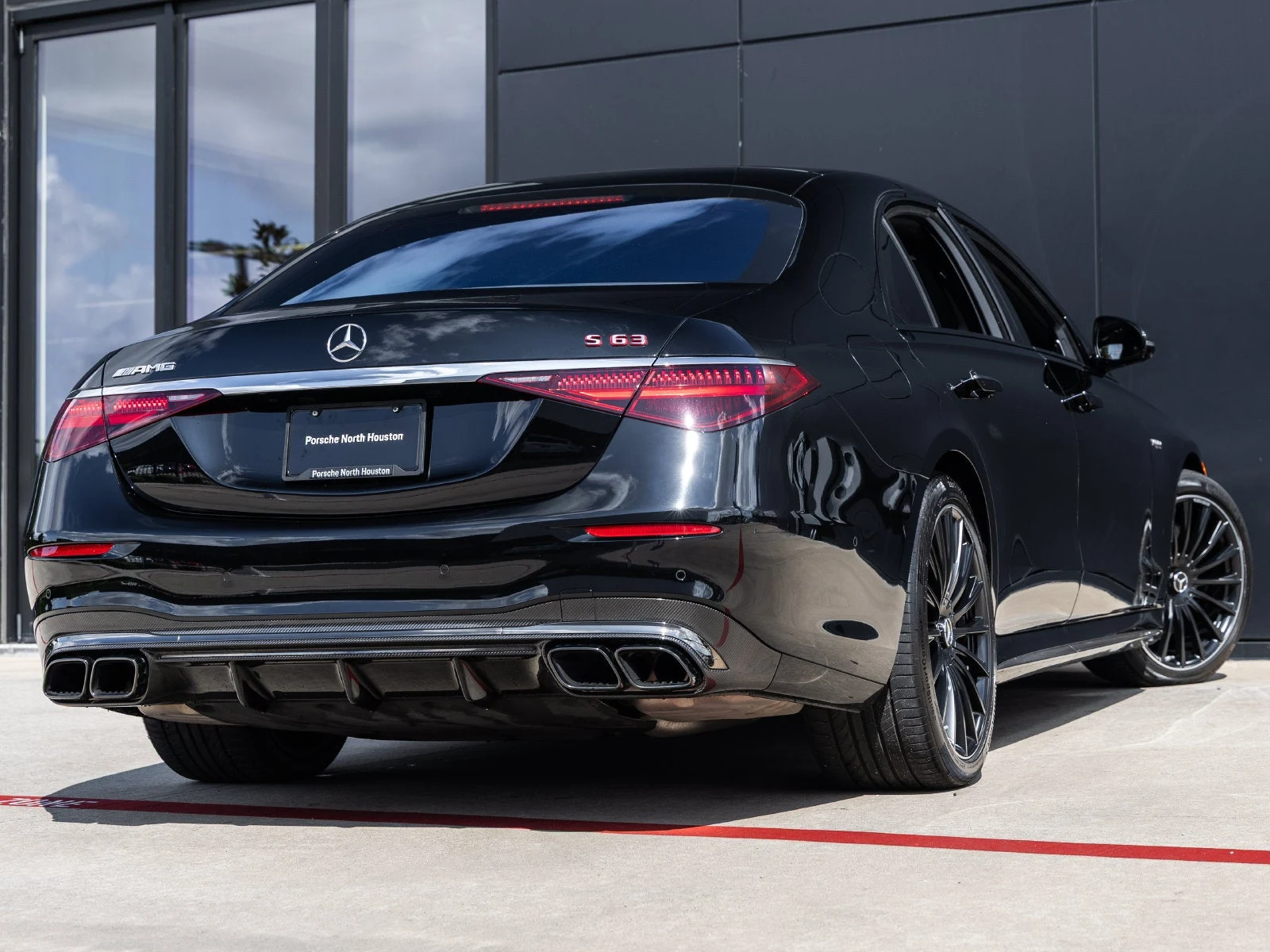 2024 Mercedes-AMG S 63 E PERFORMANCE, rear three-quarter view, Black