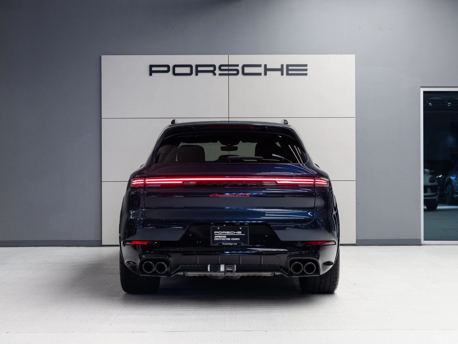 2025 Porsche Cayenne GTS, rear three-quarter view, Algarve Blue Metallic