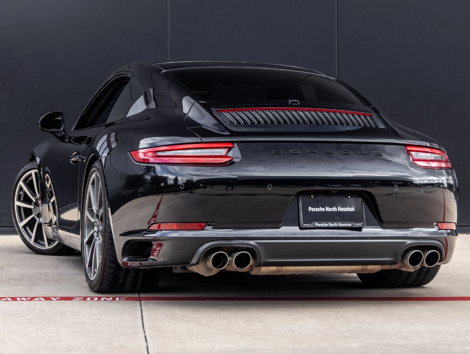 2017 Porsche 911 Carrera S, rear three-quarter view, Jet Black Metallic