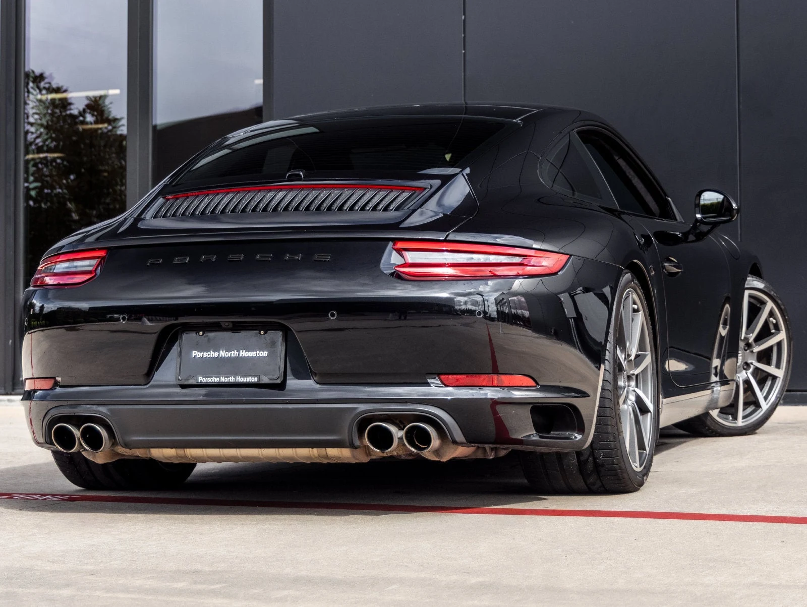 2017 Porsche 911 Carrera S, rear three-quarter view, Jet Black Metallic