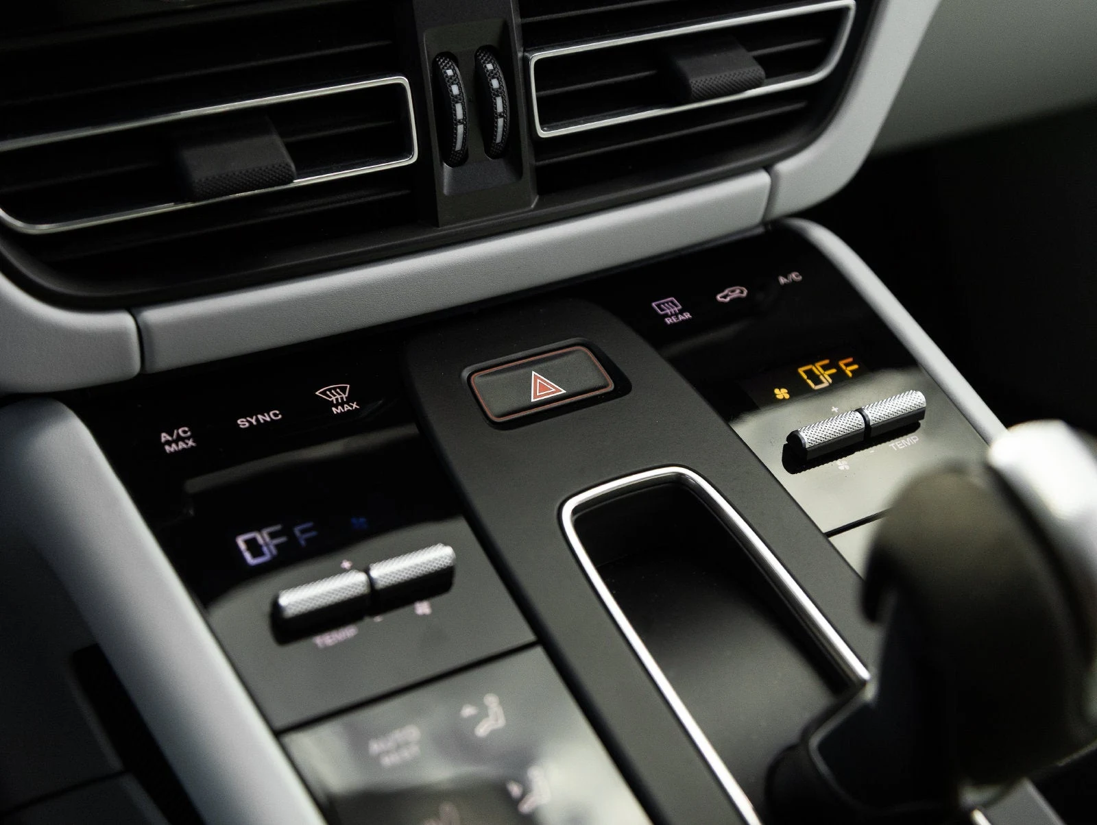 2024 Porsche Macan GTS interior, center console, Black / Pebble Grey leather
