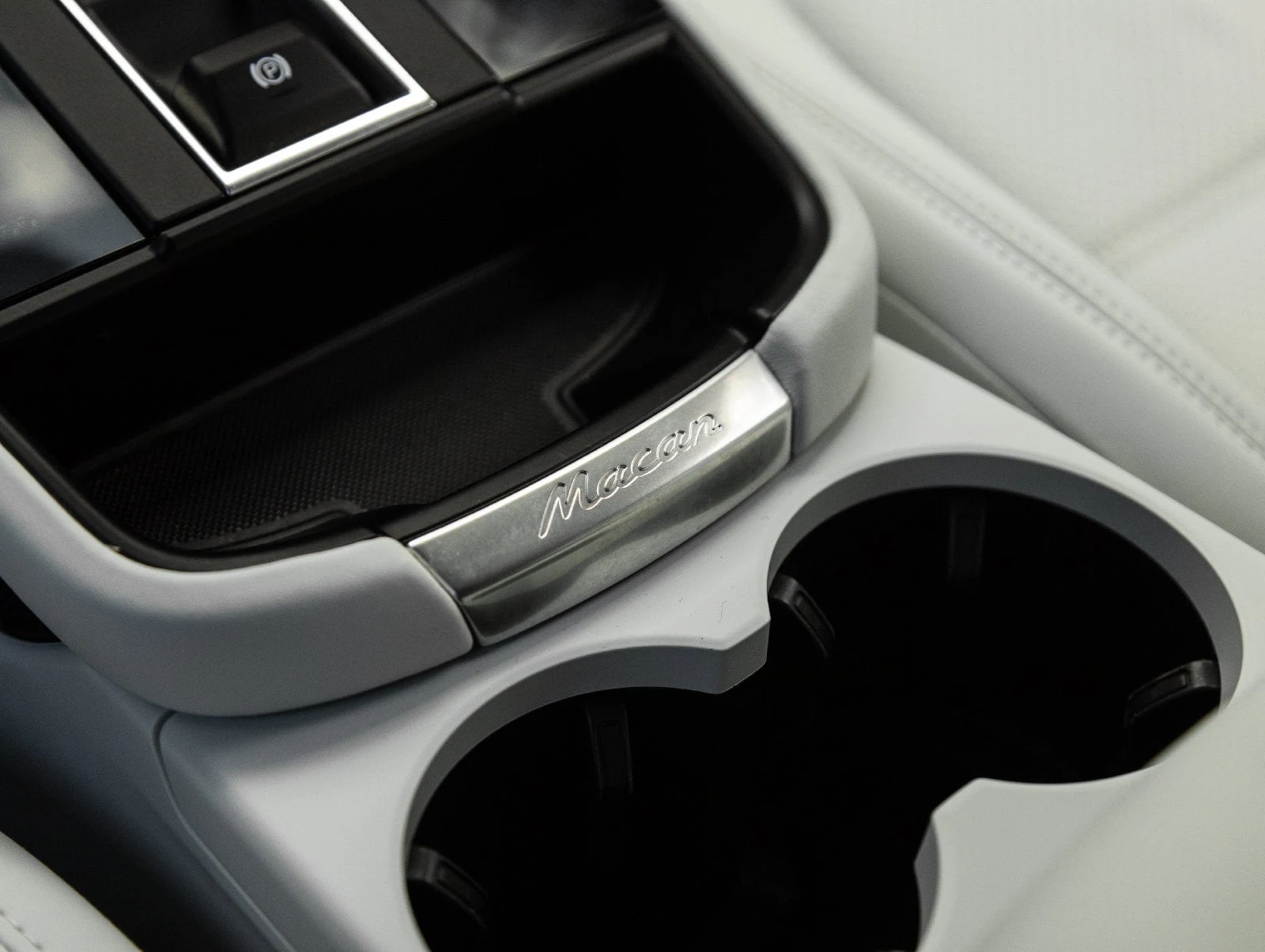 2024 Porsche Macan GTS interior, center console, Black / Pebble Grey leather