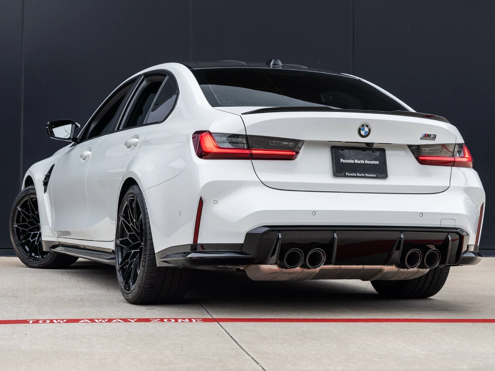 2026 BMW M3 Competition Sedan, rear three-quarter view, Alpine White