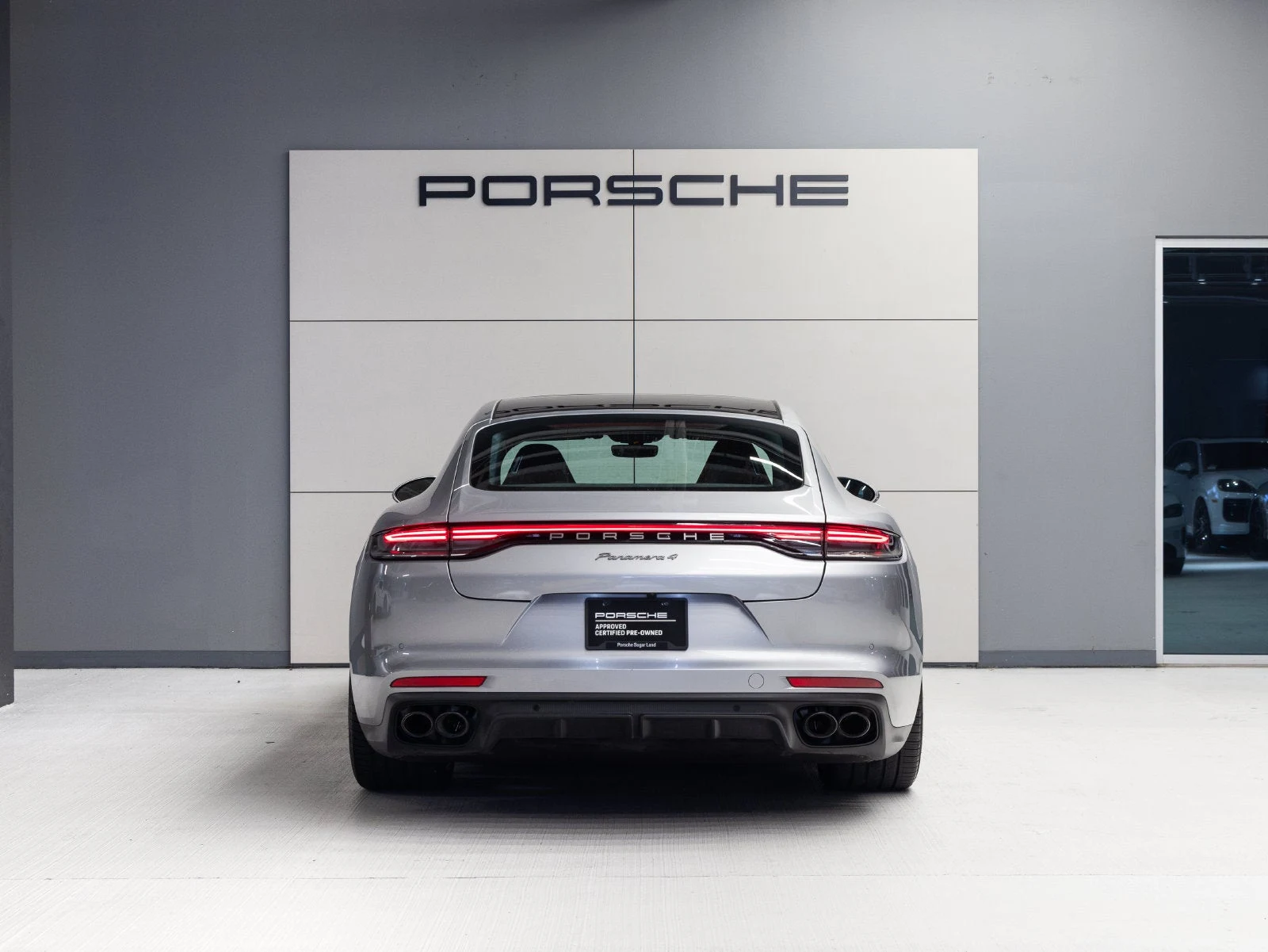 2023 Porsche Panamera 4 Platinum Edition, rear three-quarter view, GT Silver Metallic