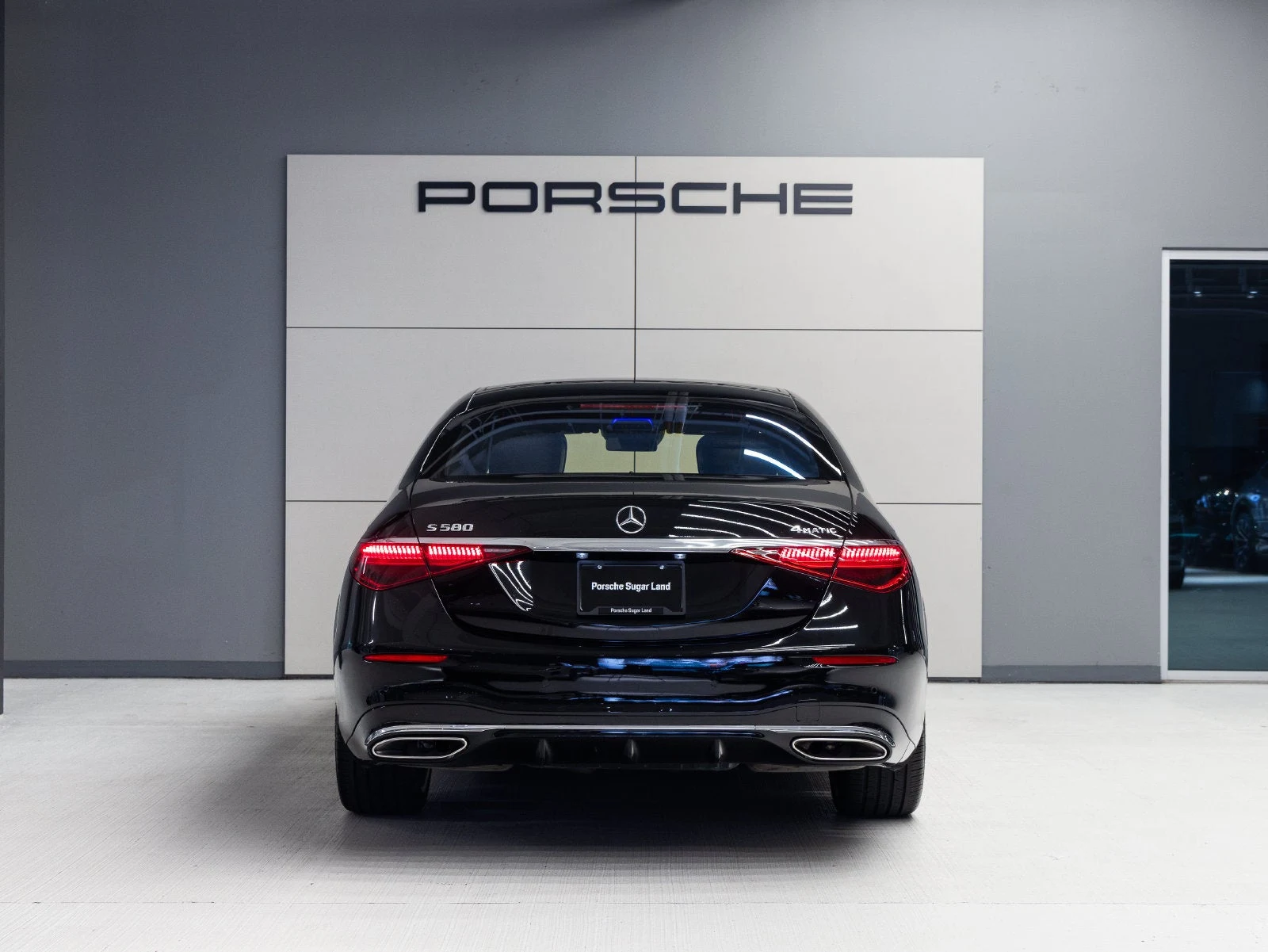 2023 Mercedes-Benz S 580 4MATIC, rear three-quarter view, Black