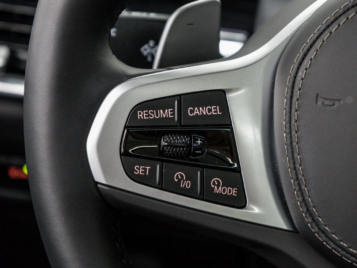 2026 BMW X5 xDrive50e interior, center console, Black Sensafin with decorative stitching