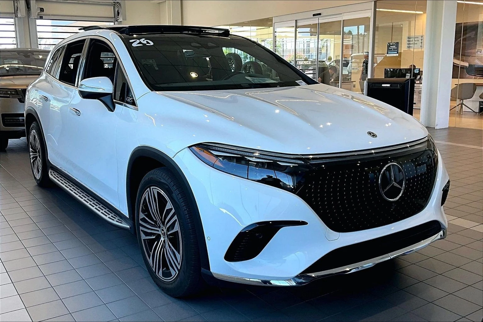 2025 Mercedes-Benz EQS 450 4MATIC SUV for sale, front three-quarter view, Polar White