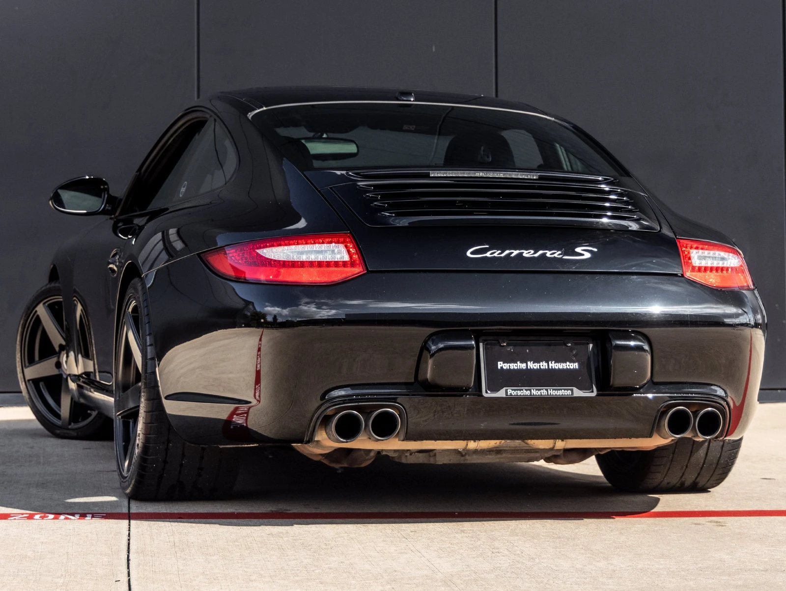 2009 Porsche 911 Carrera S PDK, rear three-quarter view, Black