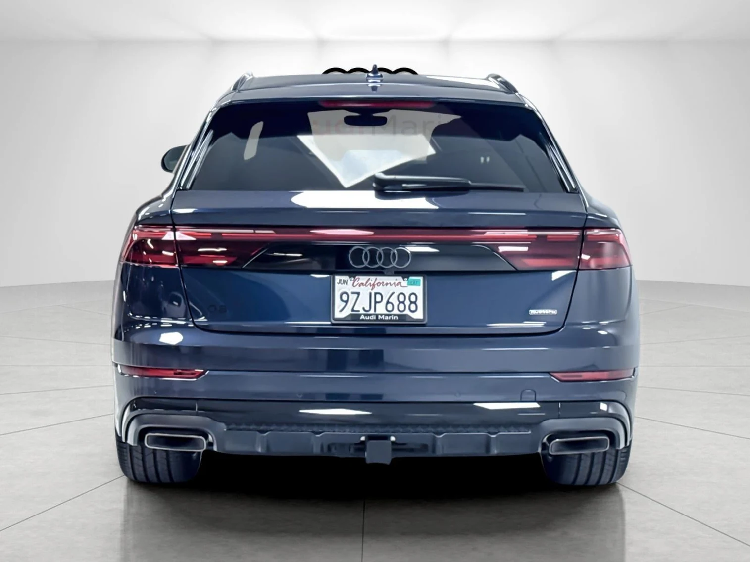 2026 Audi Q8 55 TFSI Premium Plus quattro, rear three-quarter view, Waitomo Blue Metallic