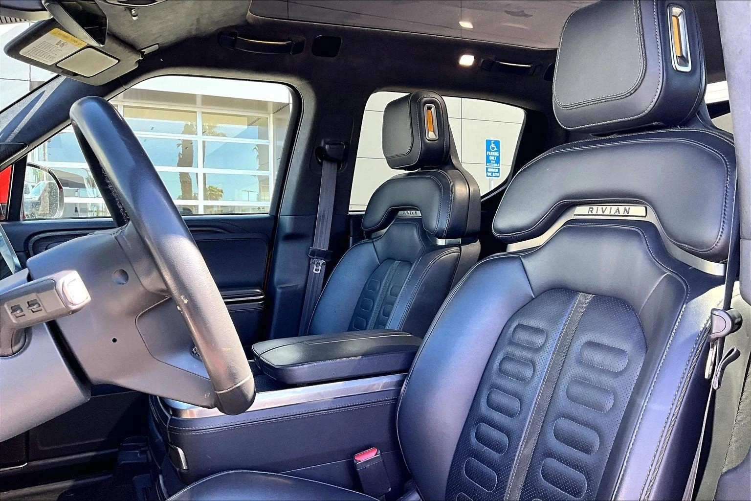 2023 Rivian R1T Adventure Quad-Motor Large Pack interior, seats, Black Mountain perforated vegan leather
