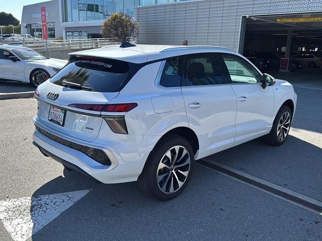 2026 Audi Q3 S line quattro, rear three-quarter view, Glacier White Metallic