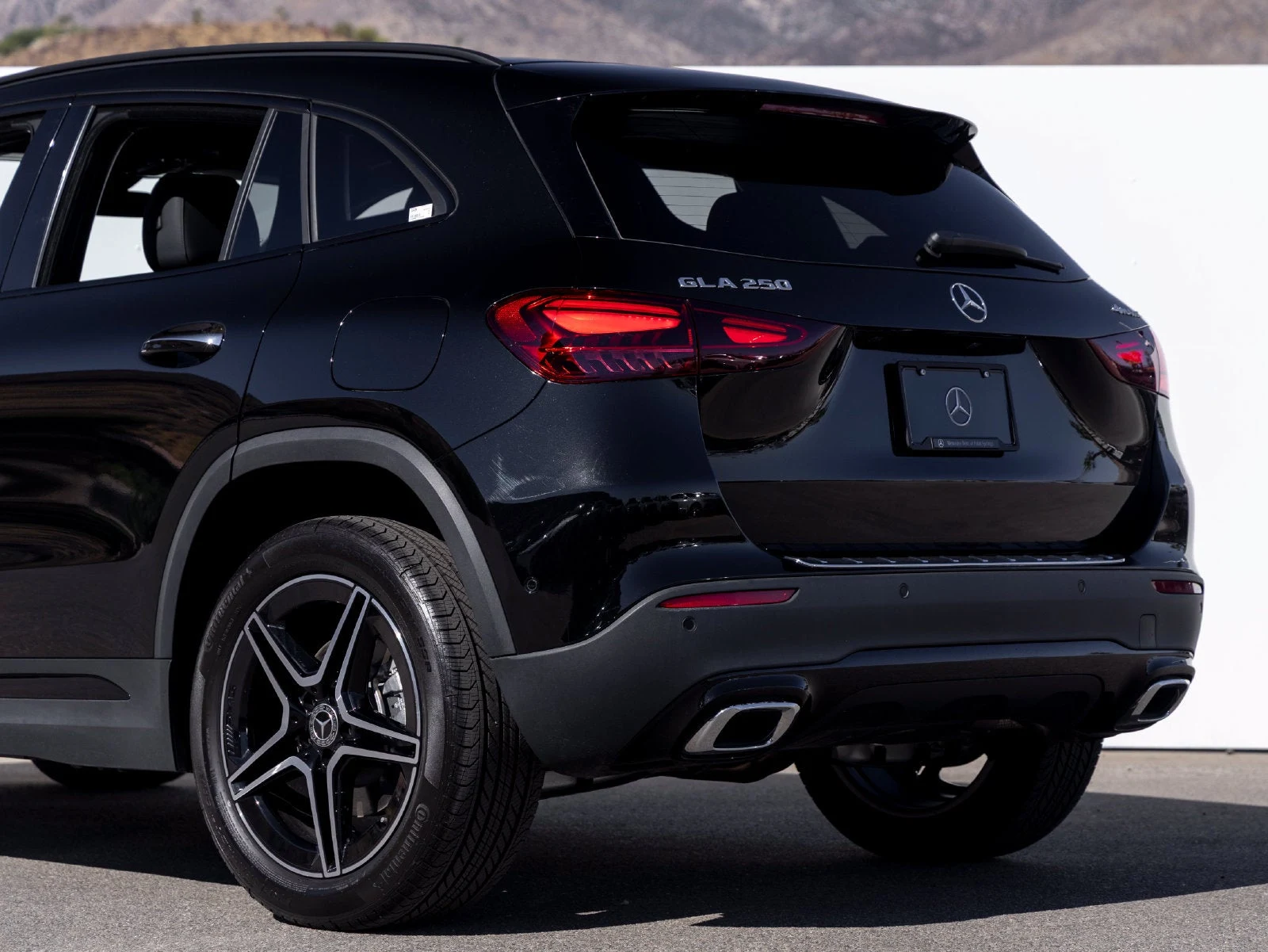 2026 Mercedes-Benz GLA 250 4MATIC, rear three-quarter view, Cosmos Black Metallic