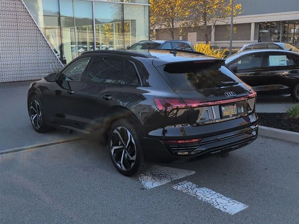 2024 Audi Q8 e-tron Prestige quattro, rear three-quarter view, Madeira Brown Metallic