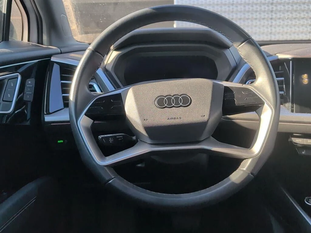 2024 Audi Q4 55 e-tron Premium Plus quattro interior, steering wheel, Black leather with Rock Gray stitching