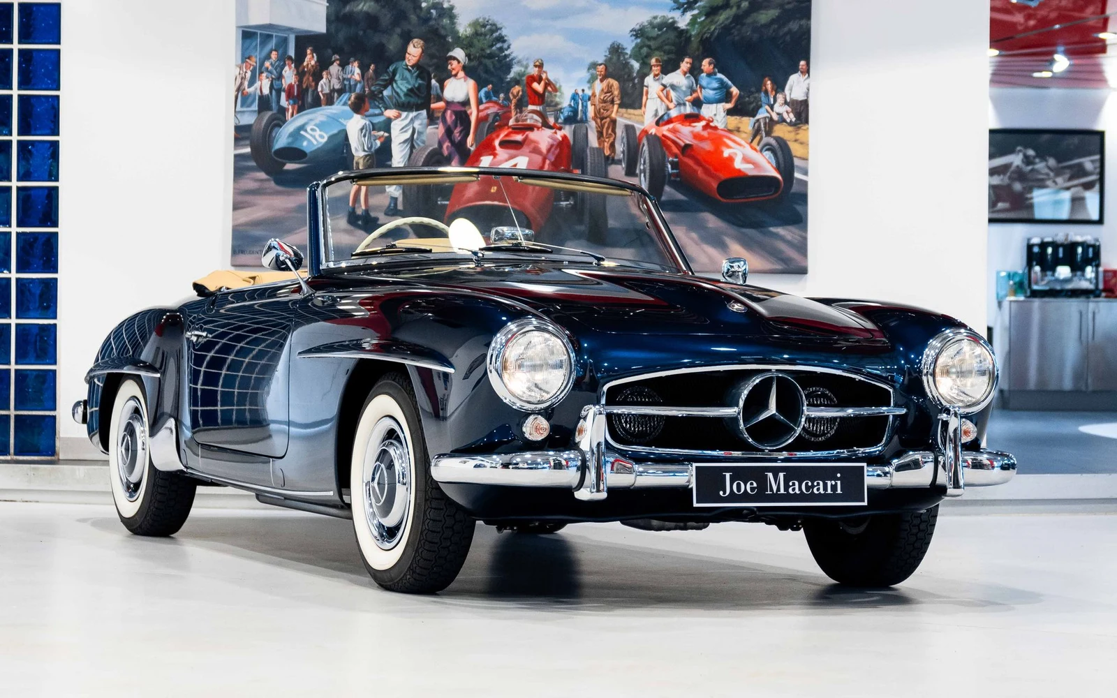 Dark blue Mercedes-Benz 190 SL, full front three-quarter view