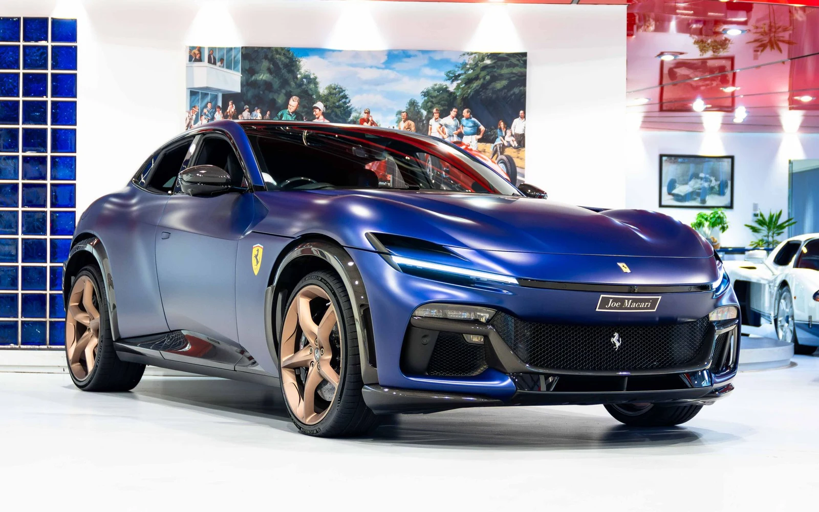 Matte blue Ferrari Purosangue, full front three-quarter view