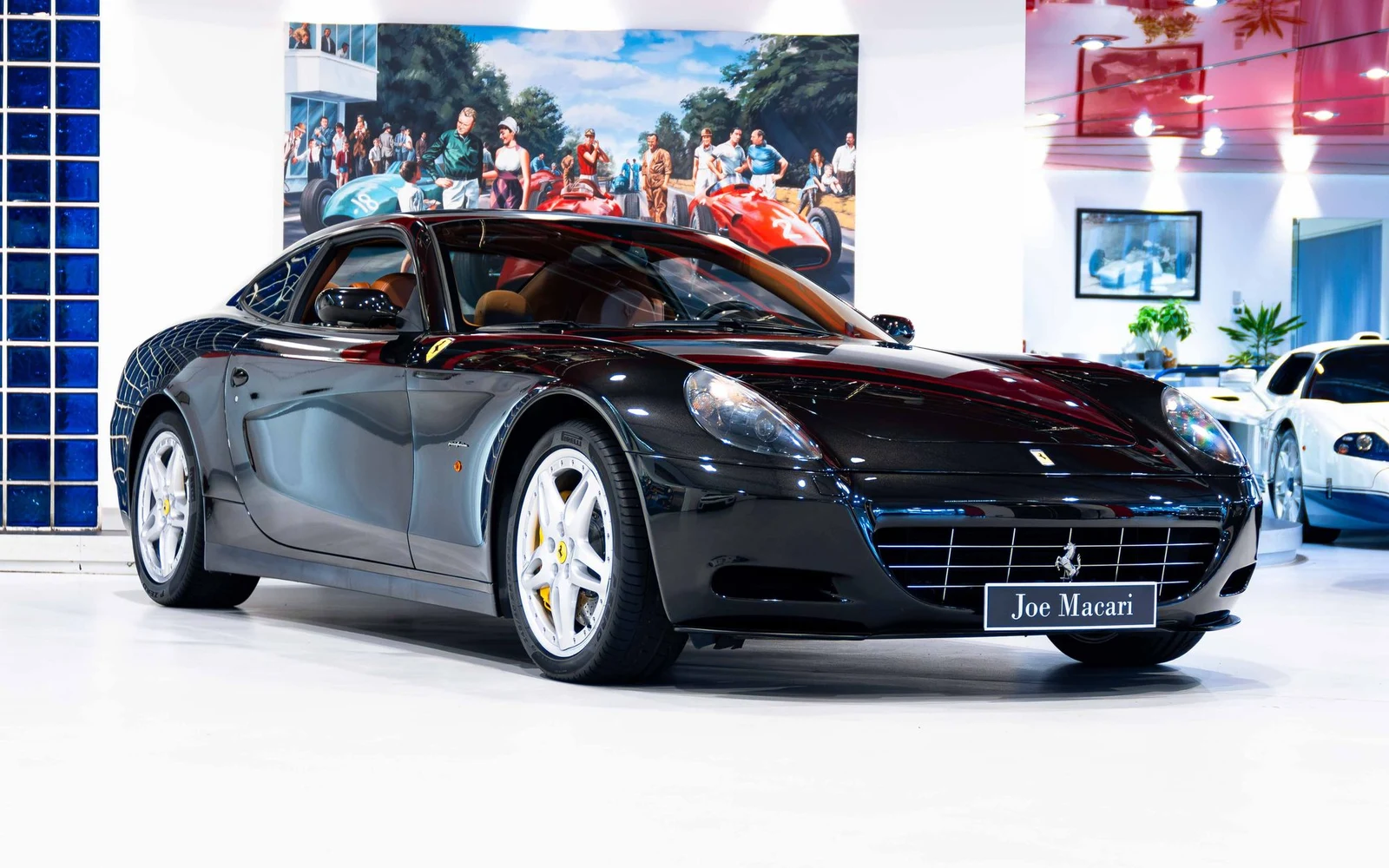 Black Ferrari 612 Scaglietti, full front three-quarter view