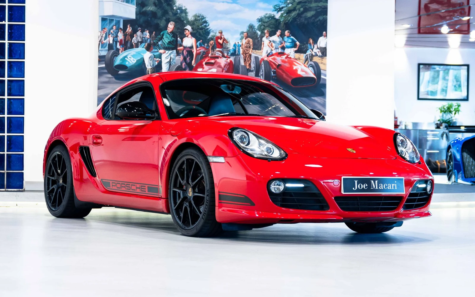Red Porsche Cayman R, full front three-quarter view