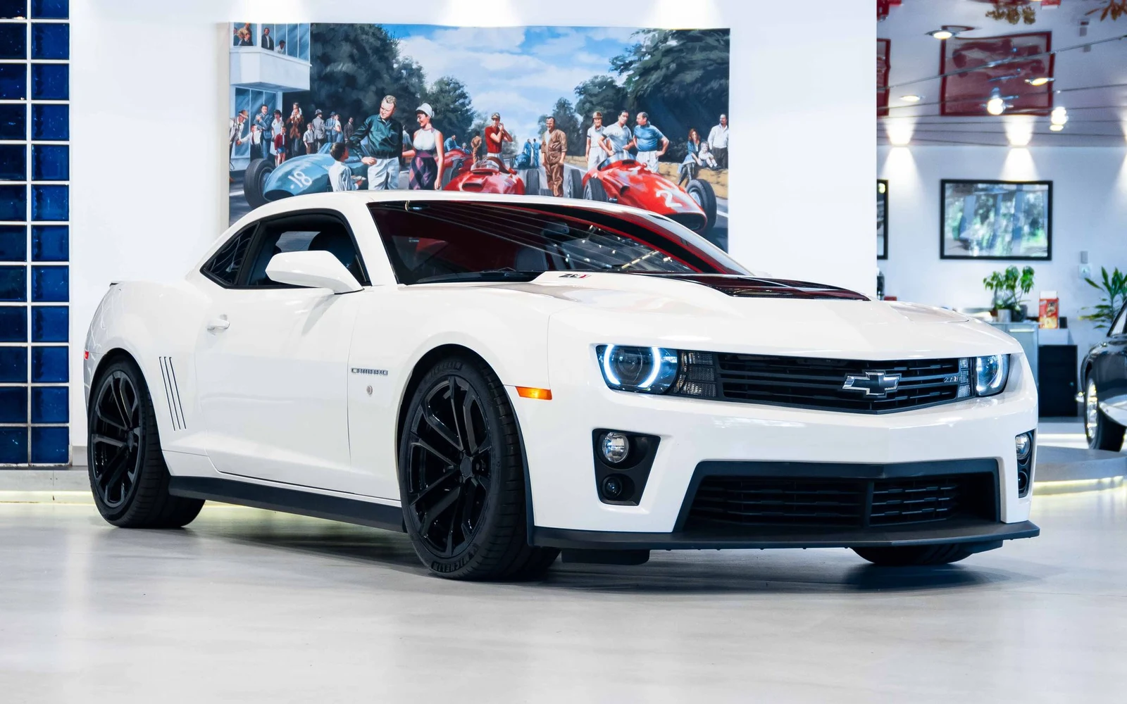 White Chevrolet Camaro ZL1, full front three-quarter view