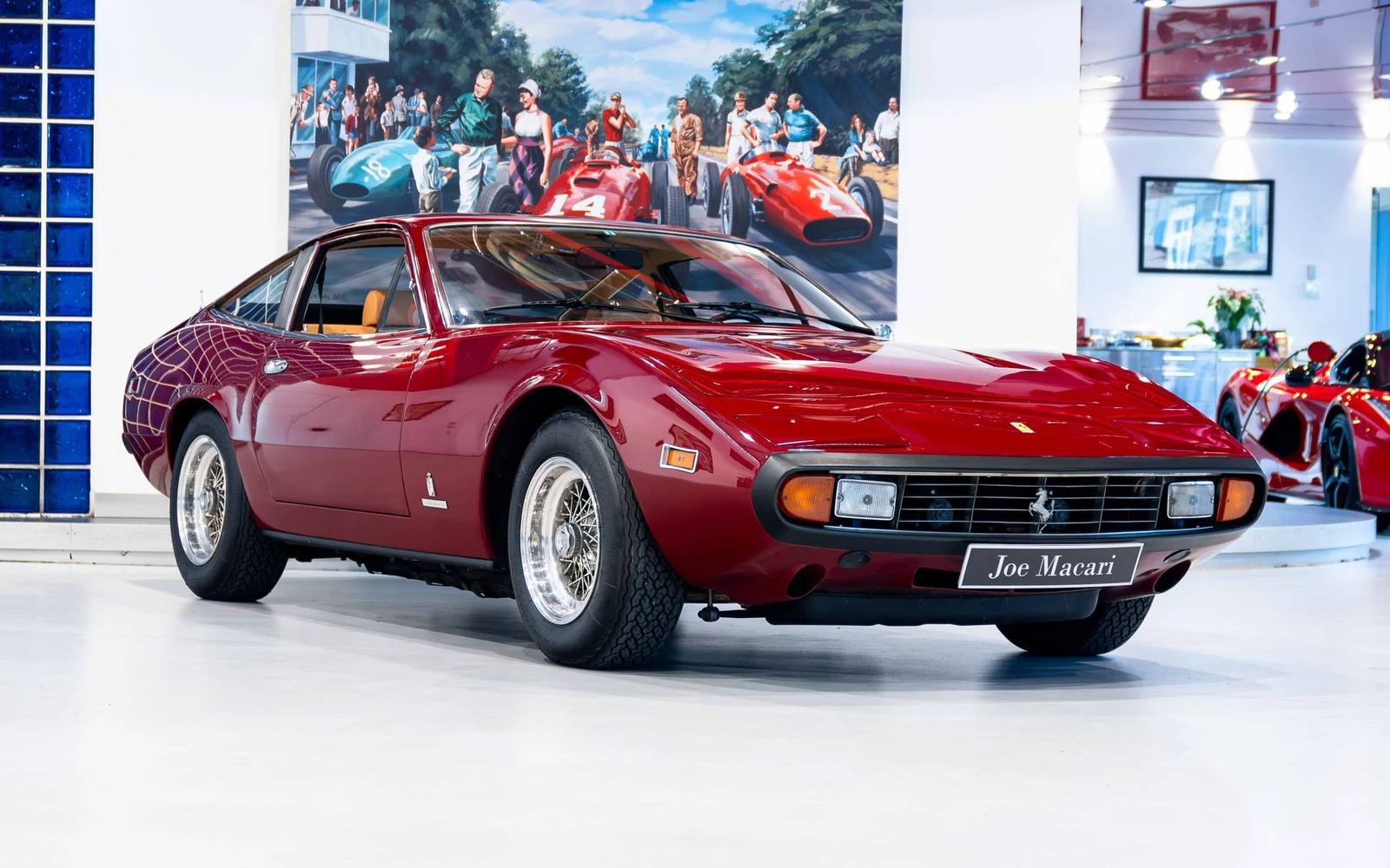 Red Ferrari 365 GTC/4, full front three-quarter view