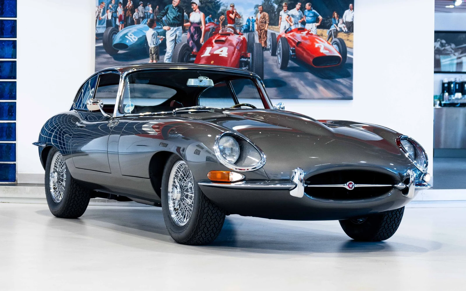 Silver grey Jaguar E-Type, full front three-quarter view