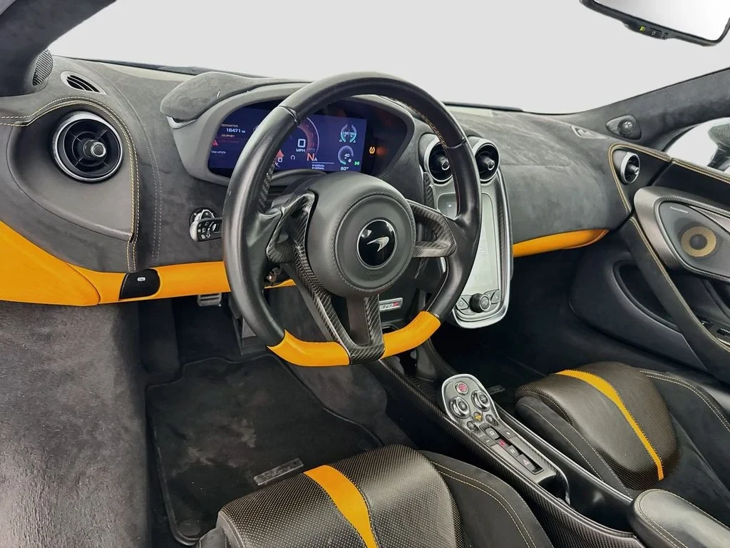2019 McLaren 570S interior, dashboard, Carbon Black, with orange accents