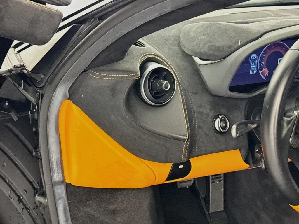 2019 McLaren 570S interior, door panel, Carbon Black, with orange accents