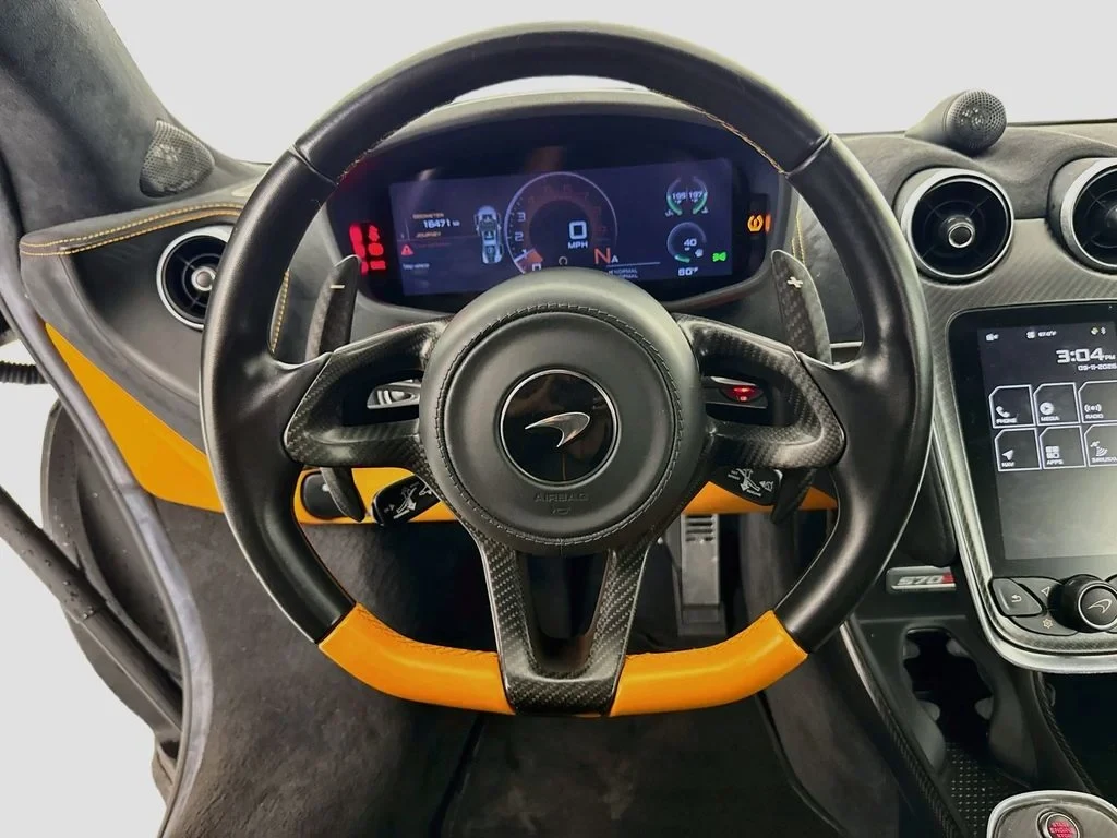 2019 McLaren 570S interior, Carbon Black, with orange accents