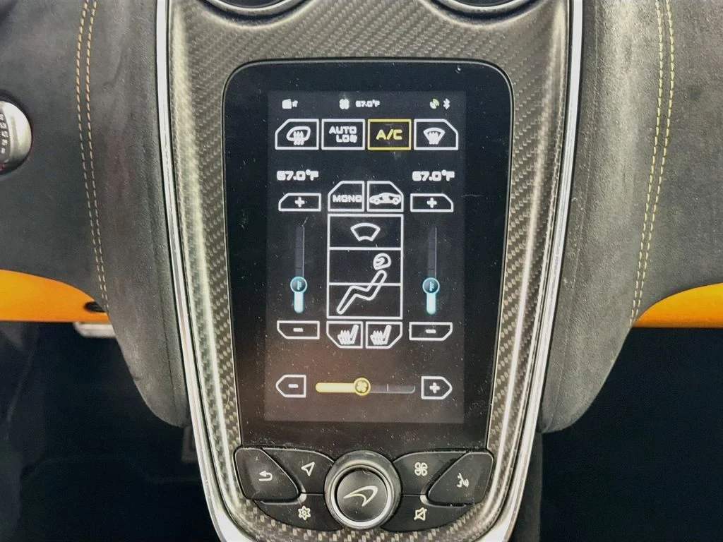 2019 McLaren 570S interior, Carbon Black, with orange accents