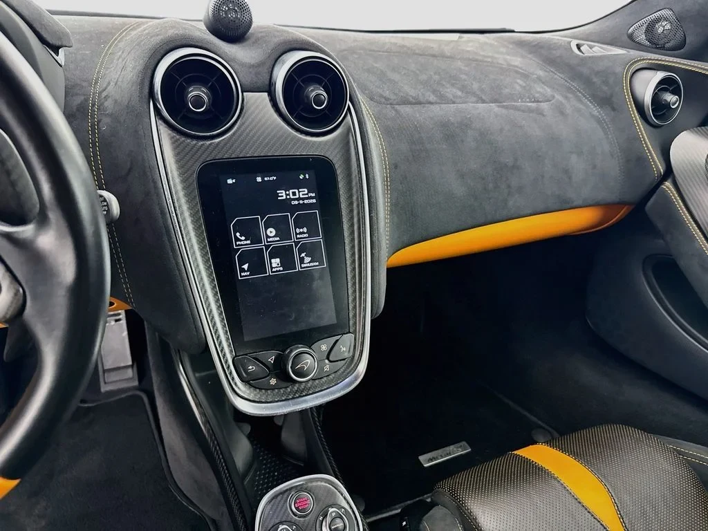 2019 McLaren 570S interior, dashboard, Carbon Black, with orange accents