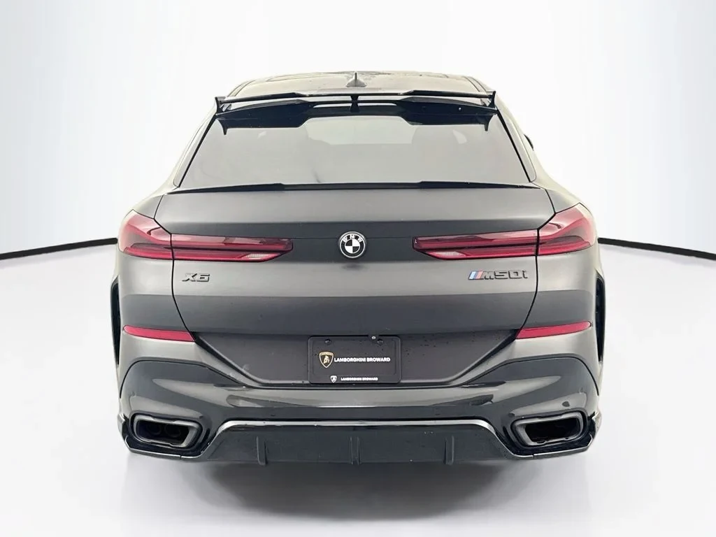 2020 BMW X6 M50i, rear three-quarter view, Grey