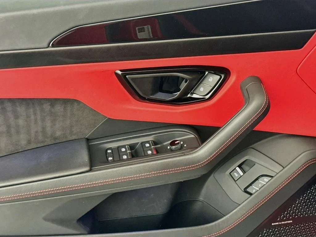 2023 Lamborghini Urus S interior, door panel, Black, with red accents