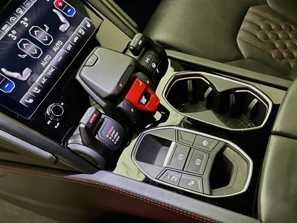 2023 Lamborghini Urus S interior, center console, Nero Ade, with red accents